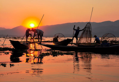 Fishermen at sunset in Myanmar